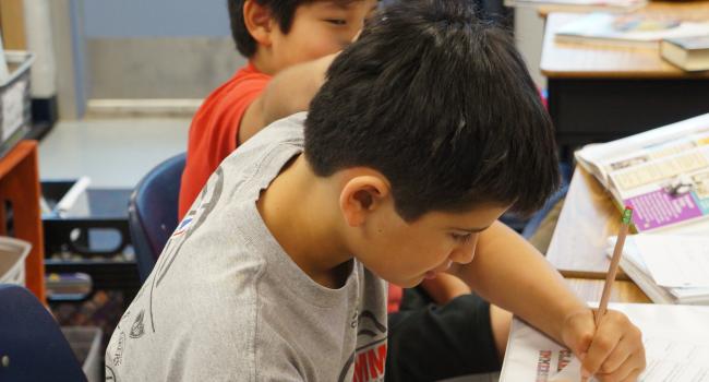 a boy writing